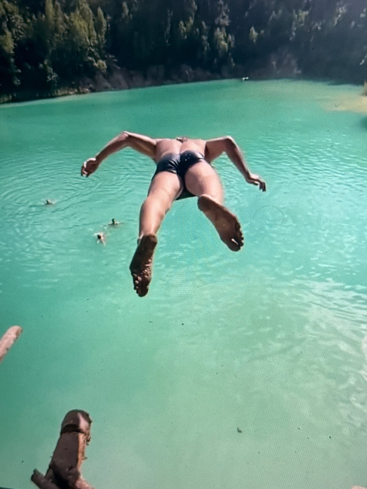 Swimmer dives into turquoise waters in Minsk