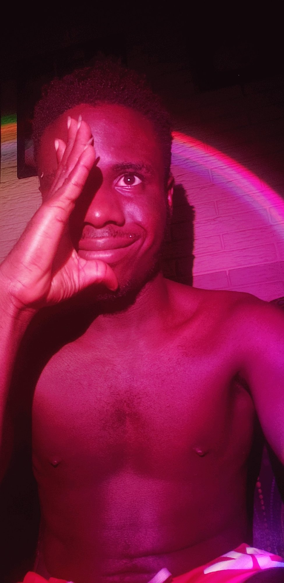 Young man photographed smiling indoors in Narayi, Nigeria