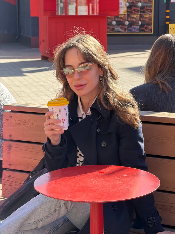 Woman enjoys coffee at Moscow's Flacon Design Factory