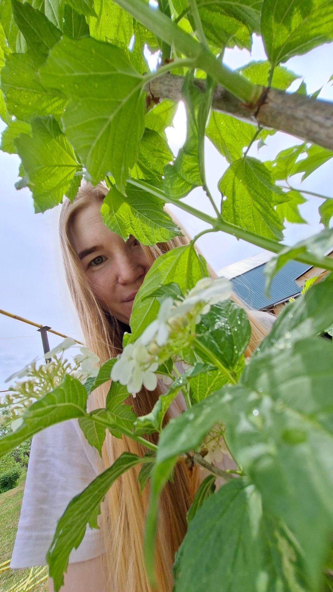 Woman photographed in rural Russian village outdoor scenes