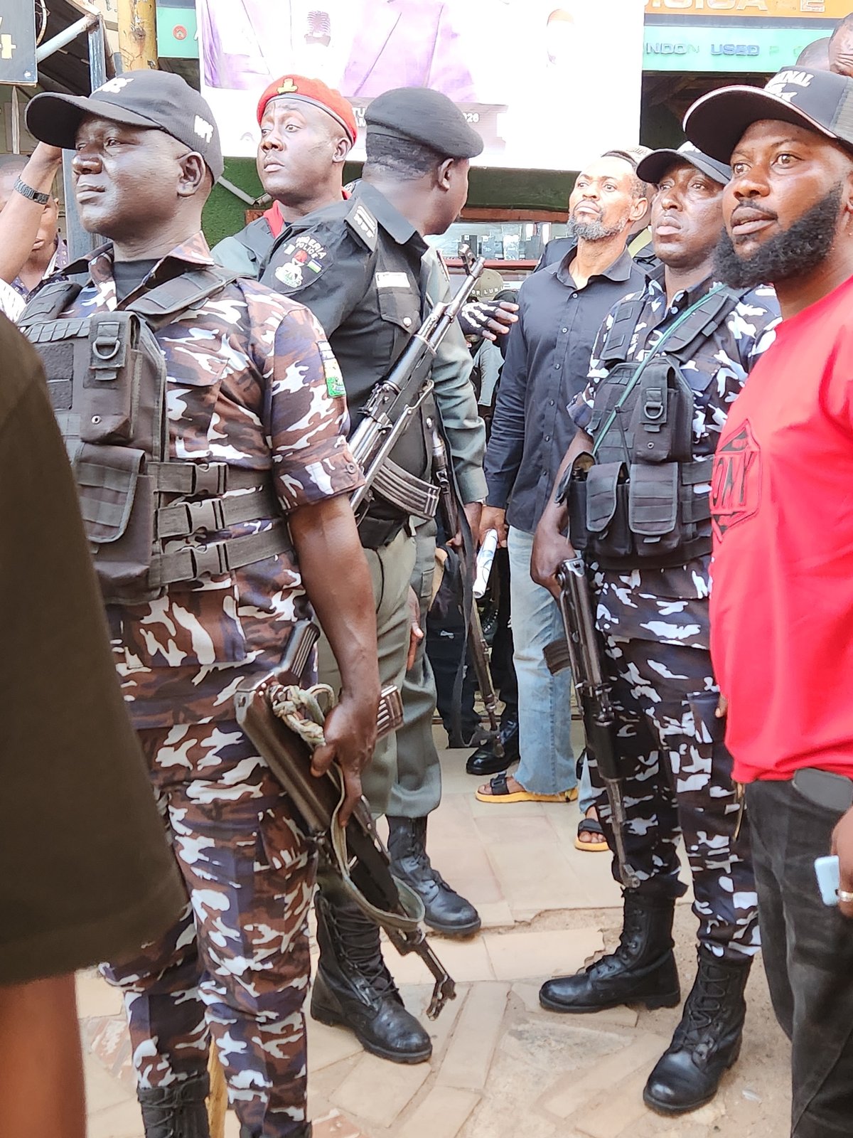 Nigerian police respond to tricycle taxi incident amid street crowds
