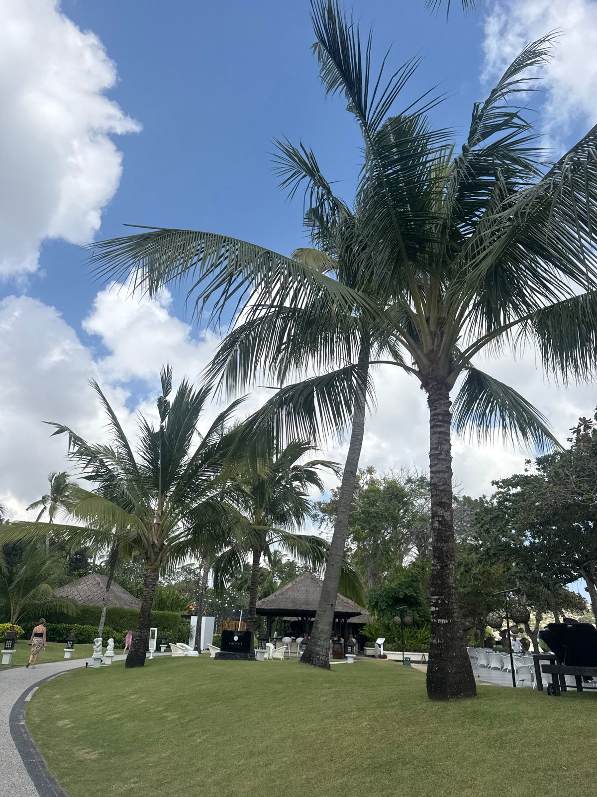 Hospitality staff walk resort grounds in Kuta Selatan, Bali