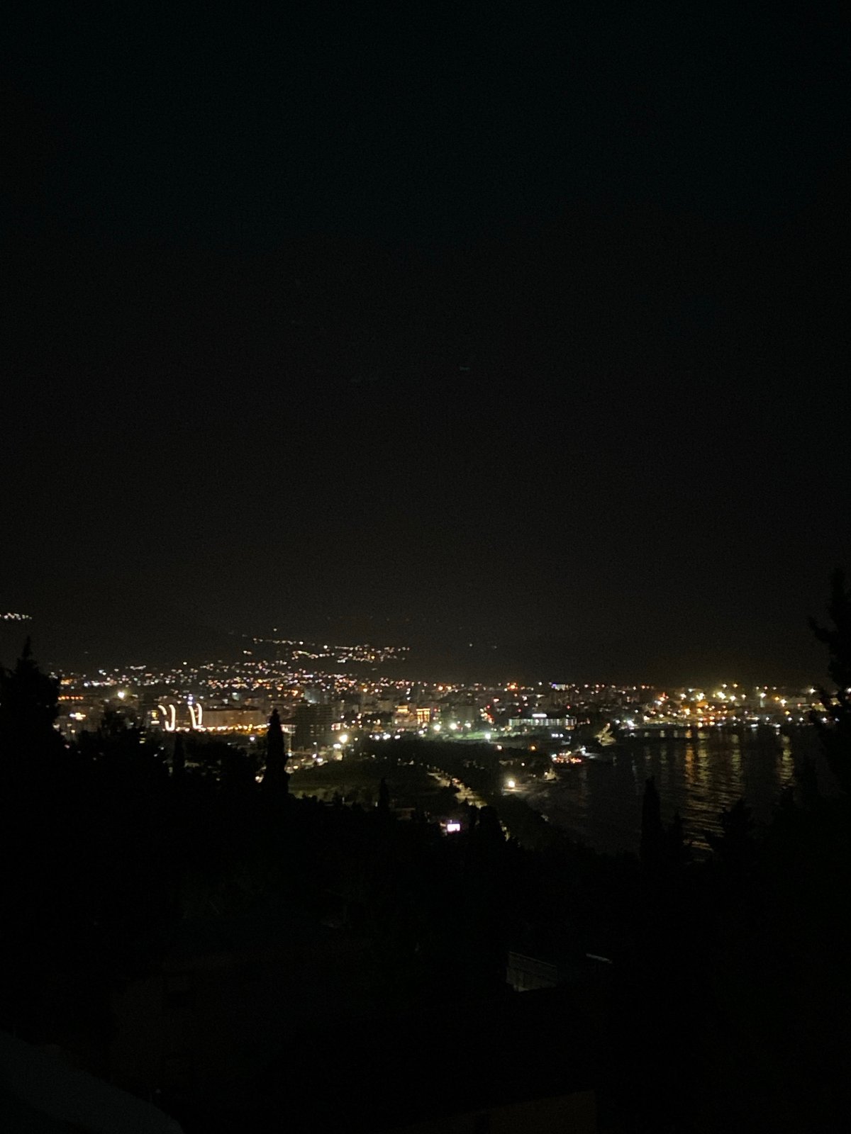 Evening lights illuminate Šušanj coastline in Montenegro