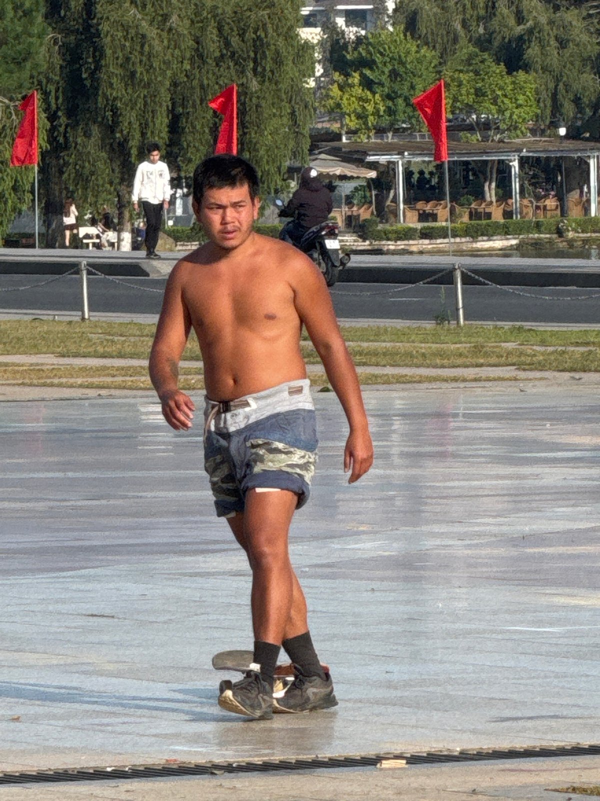 Da Lat plaza buzzing with skaters, flower motos, and street life