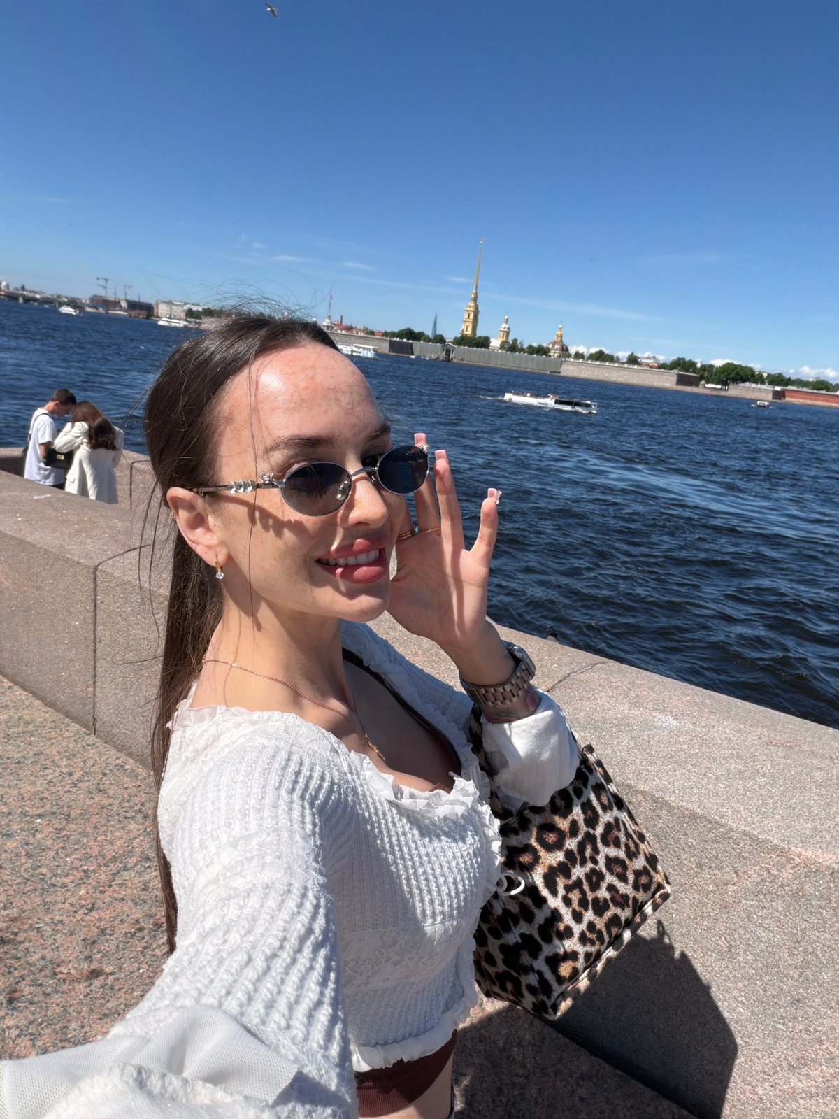 Saint Petersburg tourists enjoy sunny morning along Neva River