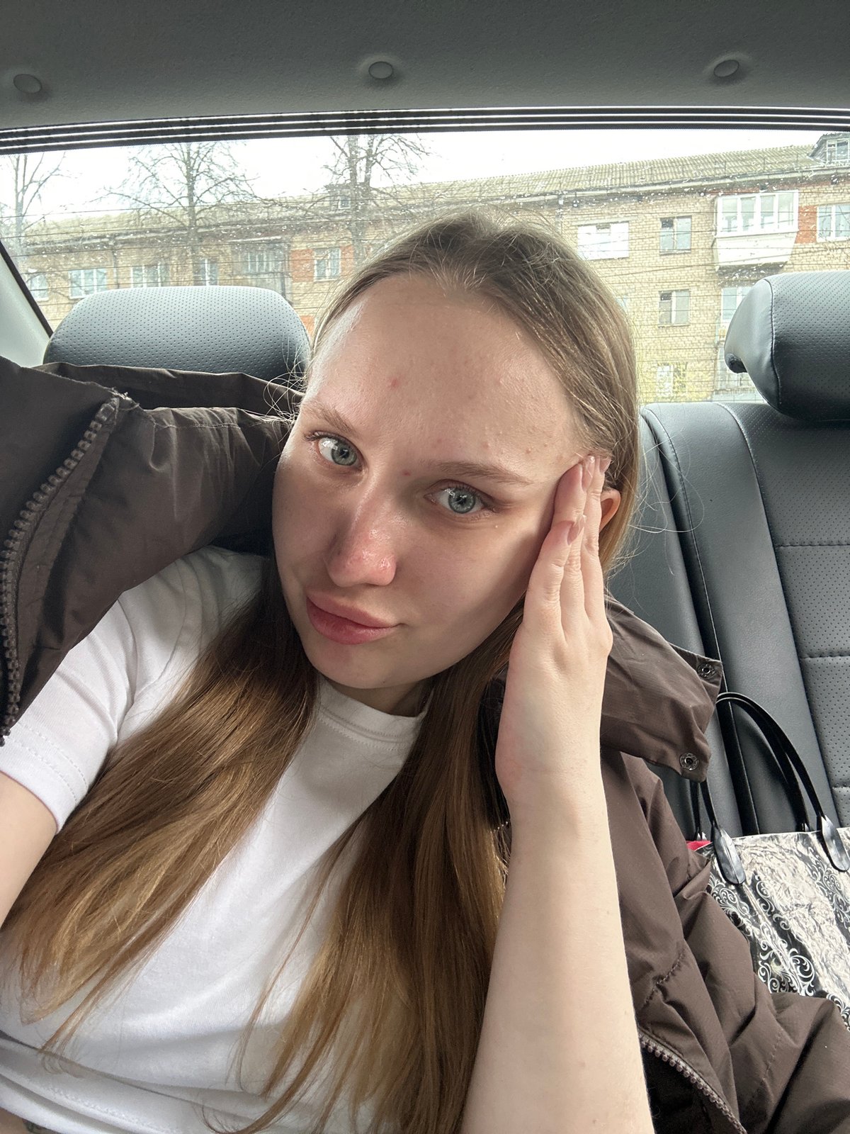 Woman takes rotated selfie in car in Chaikovsky, Russia