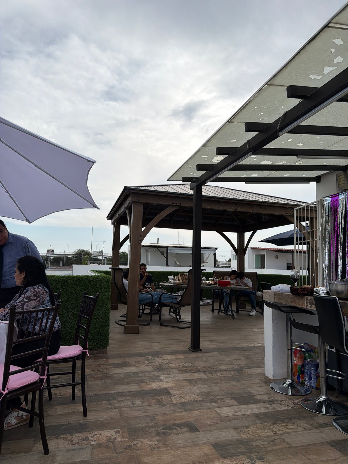 Outdoor patio with wooden flooring observed in Mexican town