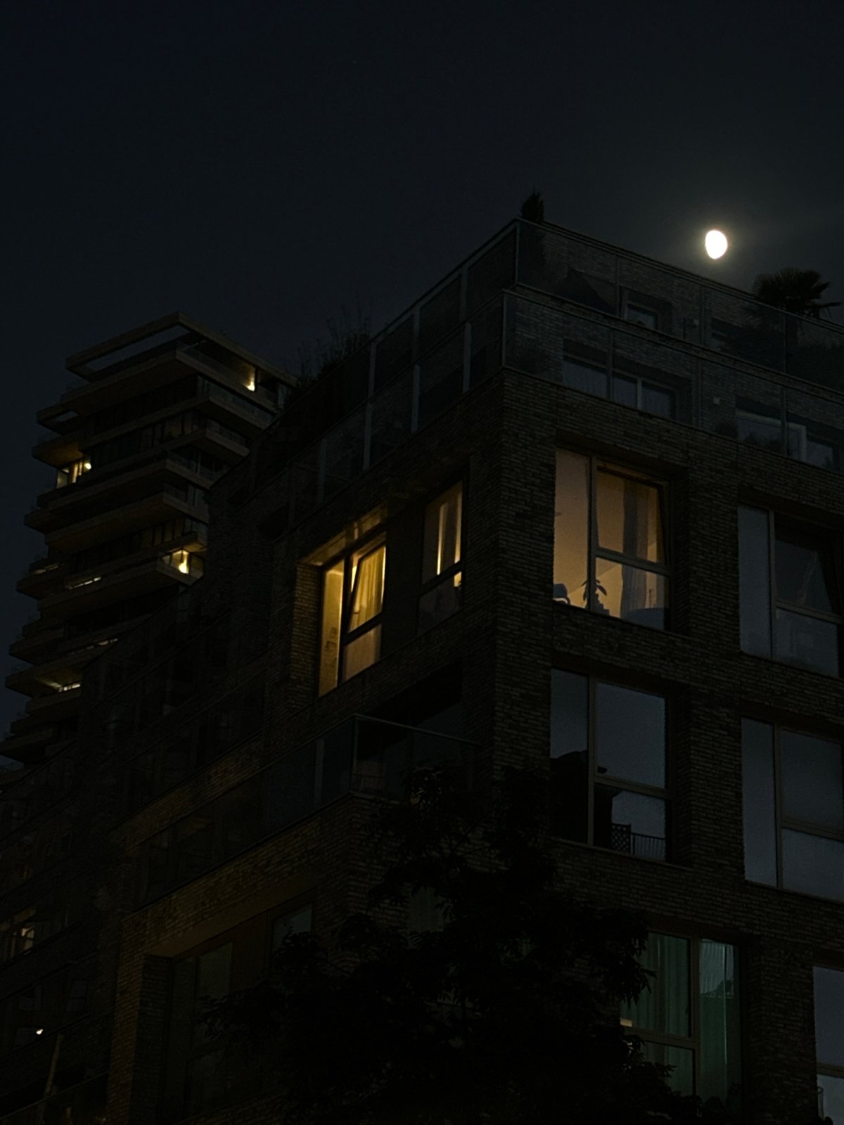 Amsterdam apartment building glows under full moon Monday night