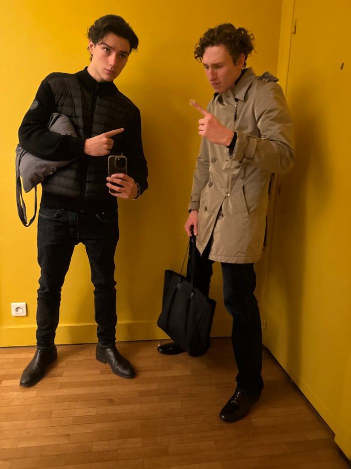 Two men with umbrella observed in Paris room