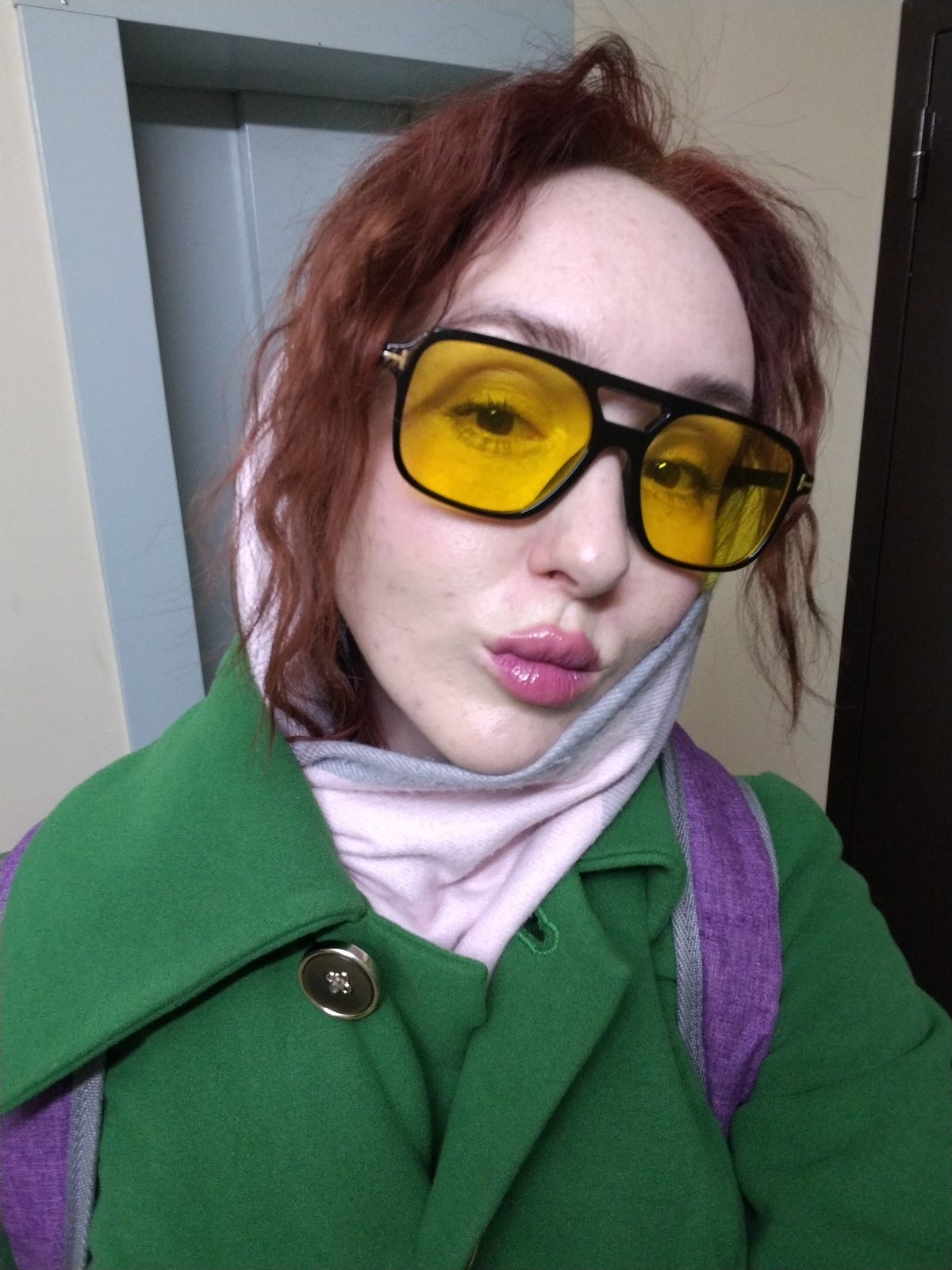 Person in yellow-lensed sunglasses photographed in Izhevsk selfie