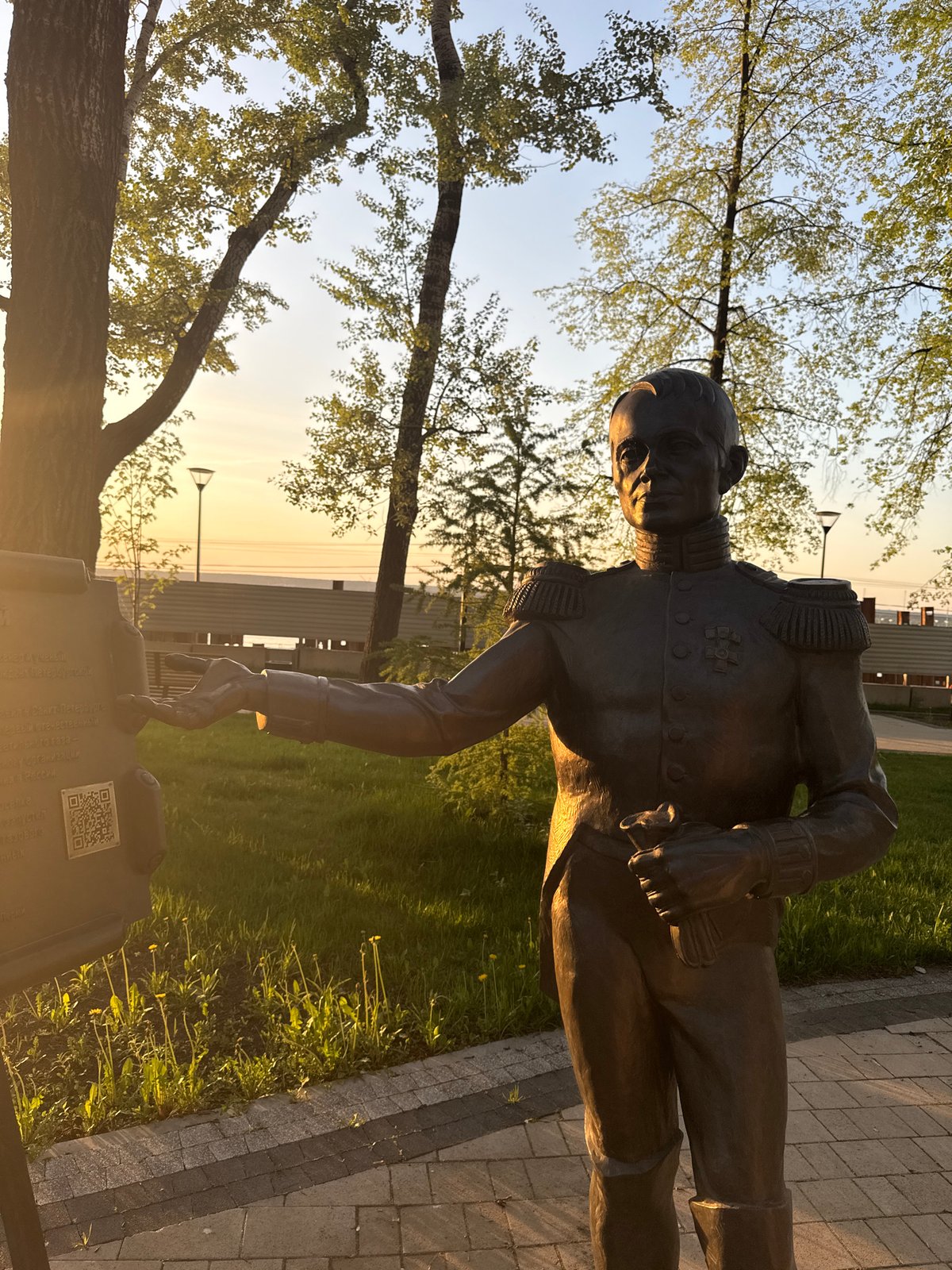 Visitors photograph bronze military statue in Perm park