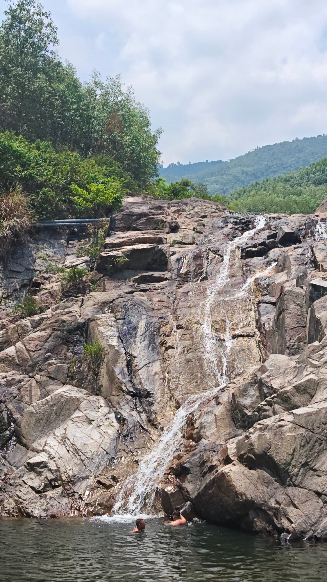 Tourists photograph waterfall visit in Đà Nẵng Vietnam