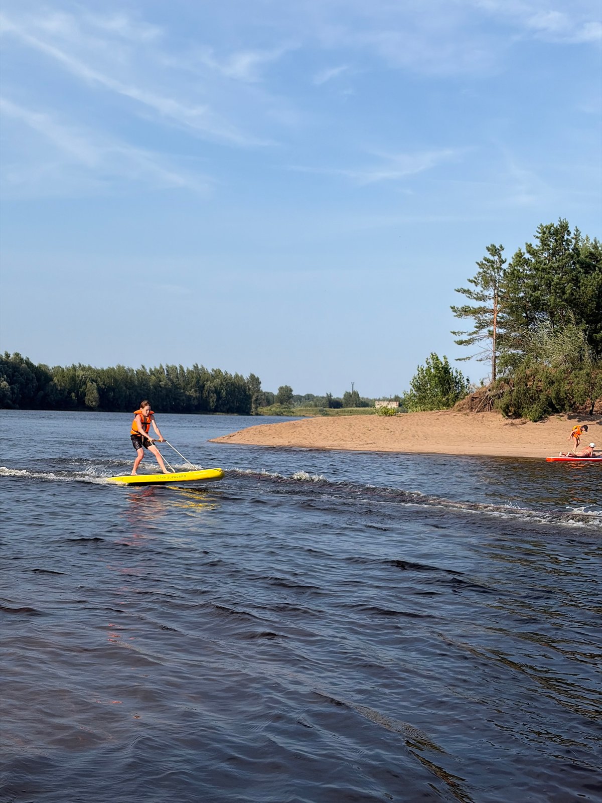 Lazy summer afternoon on the riverbank in Noviy, Russia