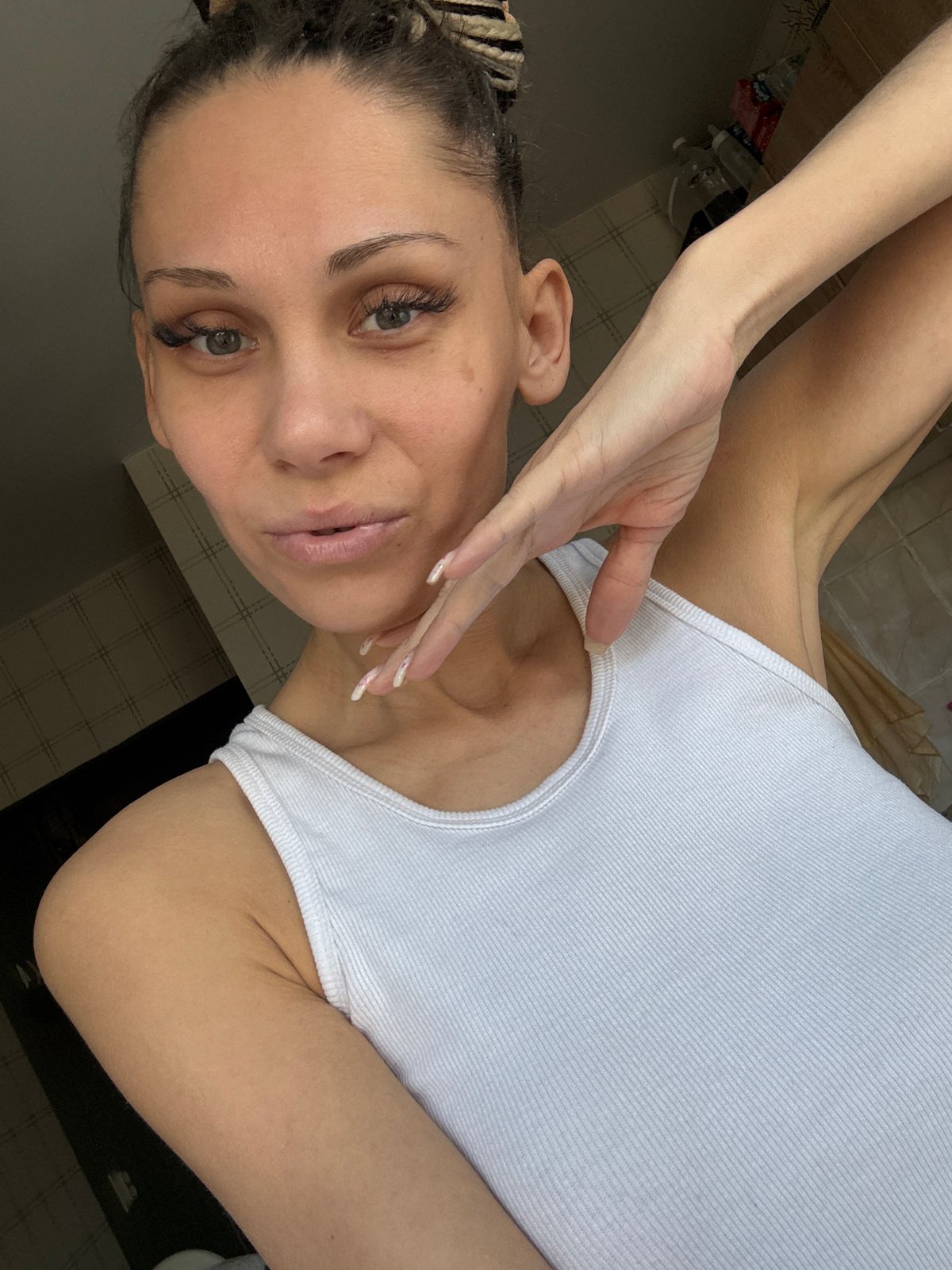 Woman in white tank top observed in Rusanovo