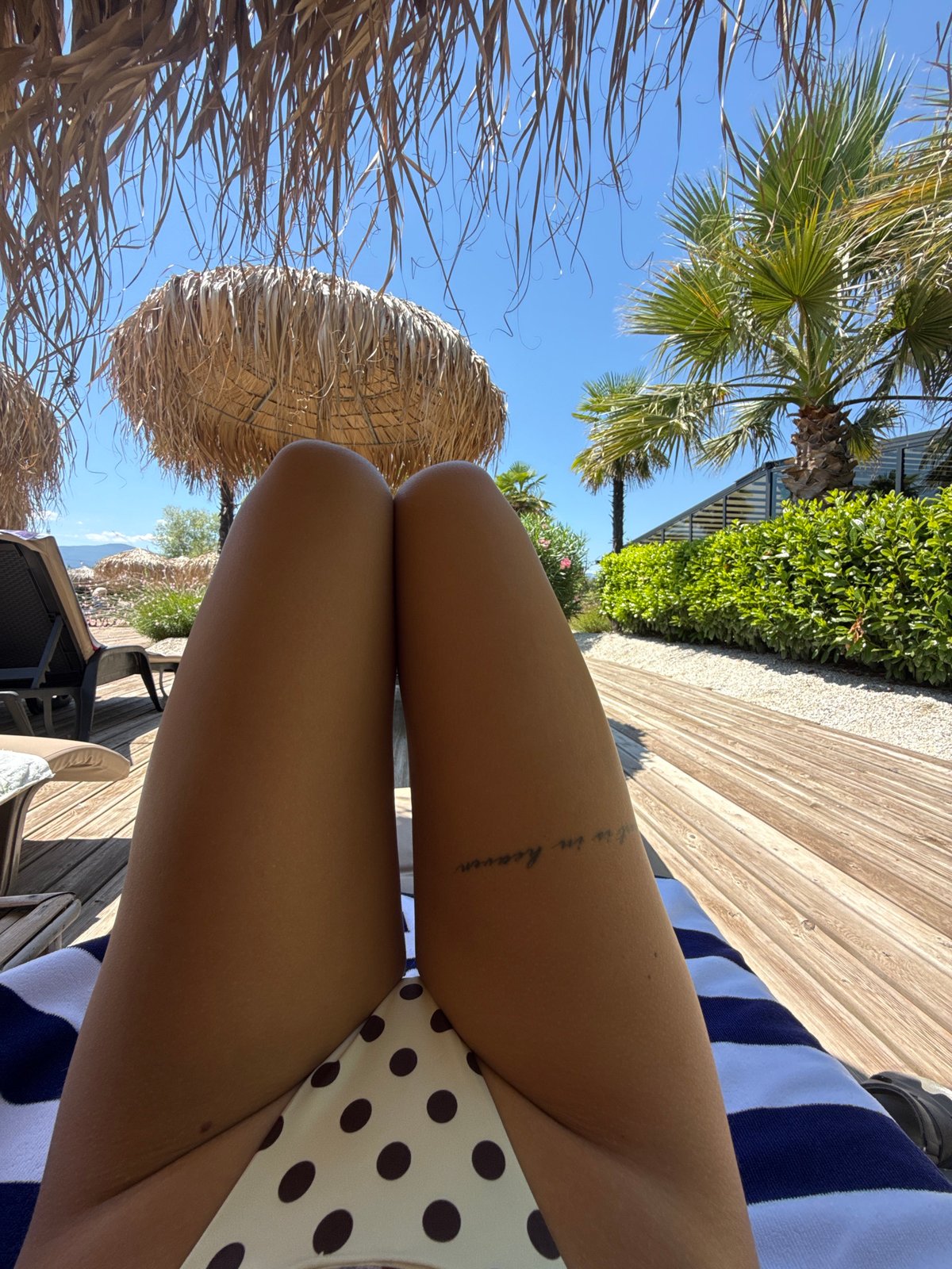 Lounging under thatched umbrellas at a sunny Plovdiv beach club