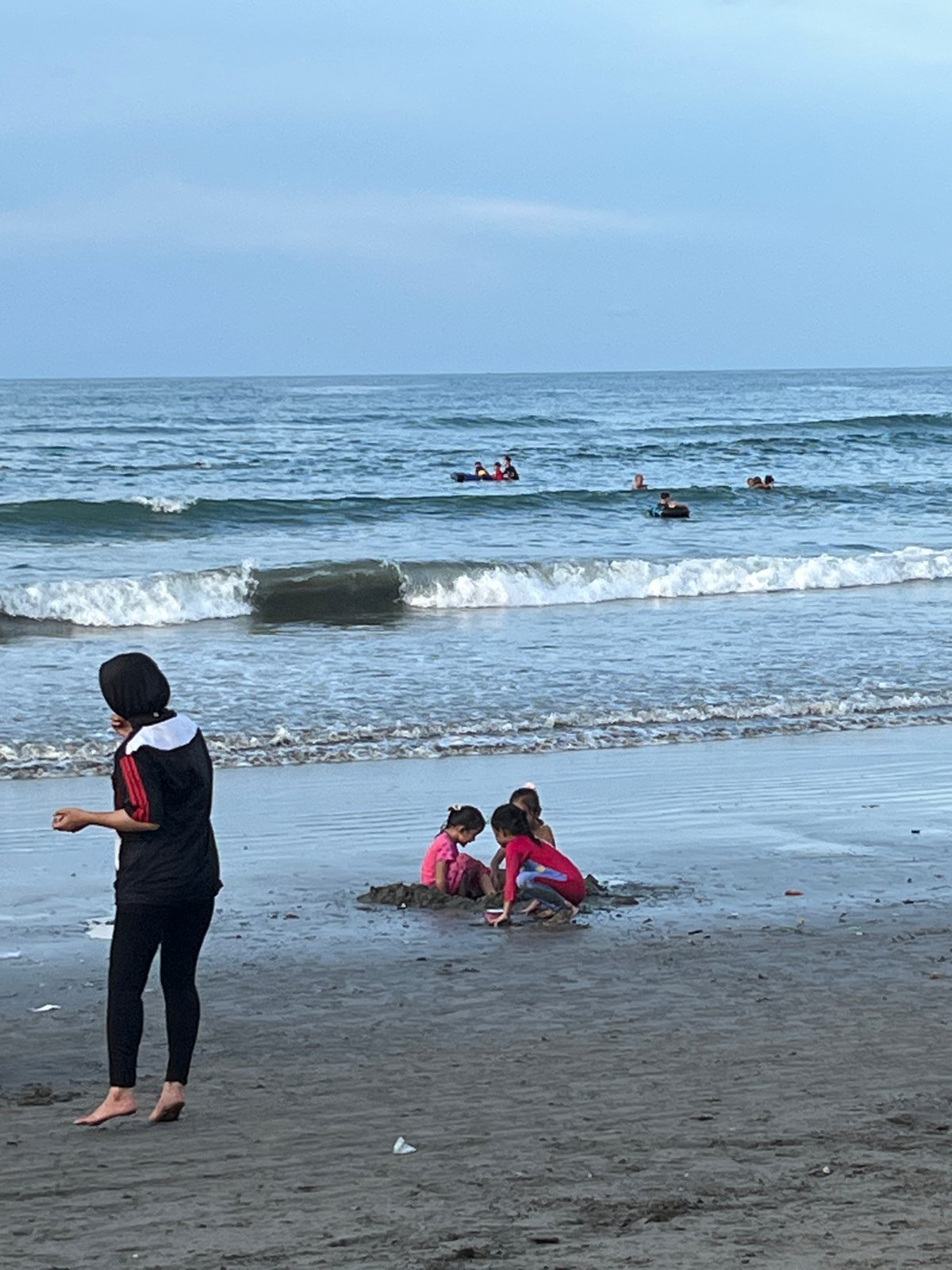 Families enjoy beach day in Lhokseumawe, Indonesia