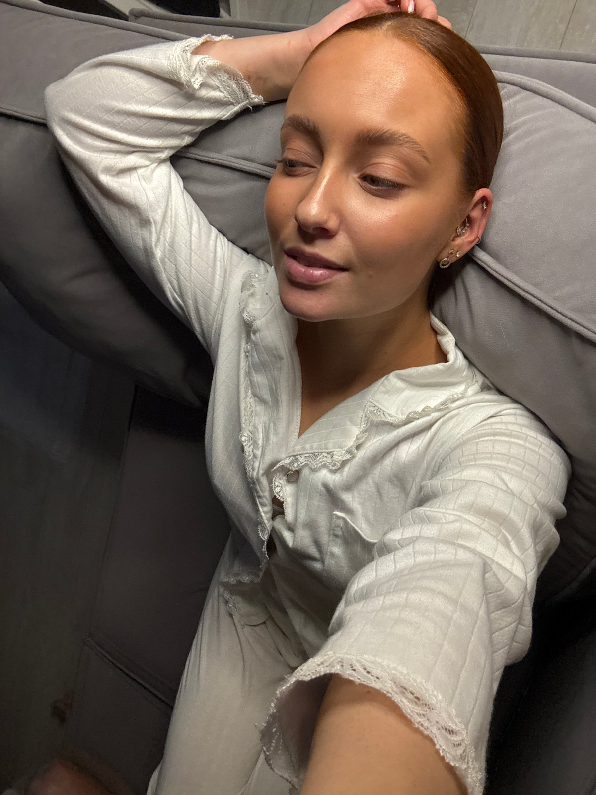Woman rests on couch in Chaikovsky, Russia
