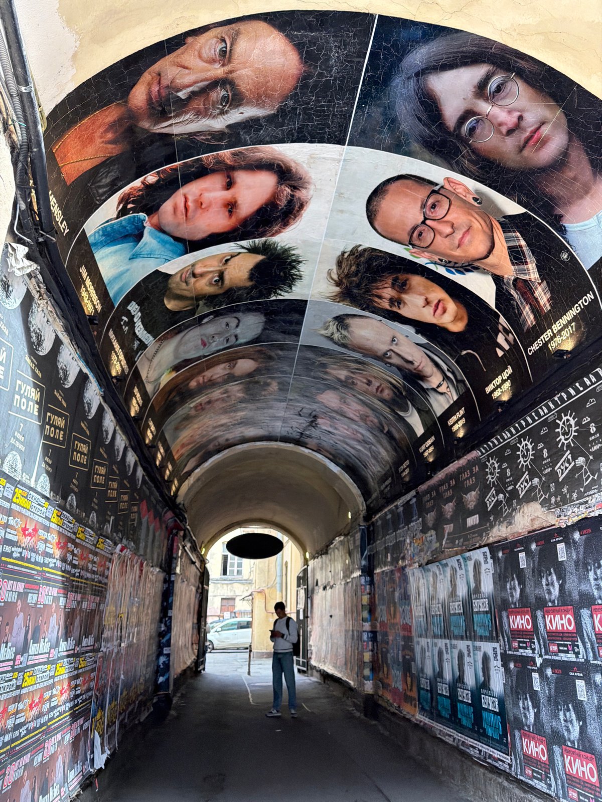Street-level city walk: murals, music tunnels, and residential blocks