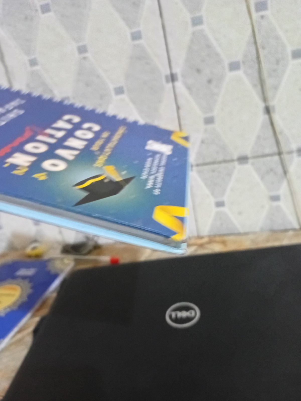 Graduation materials observed including convocation book and cap