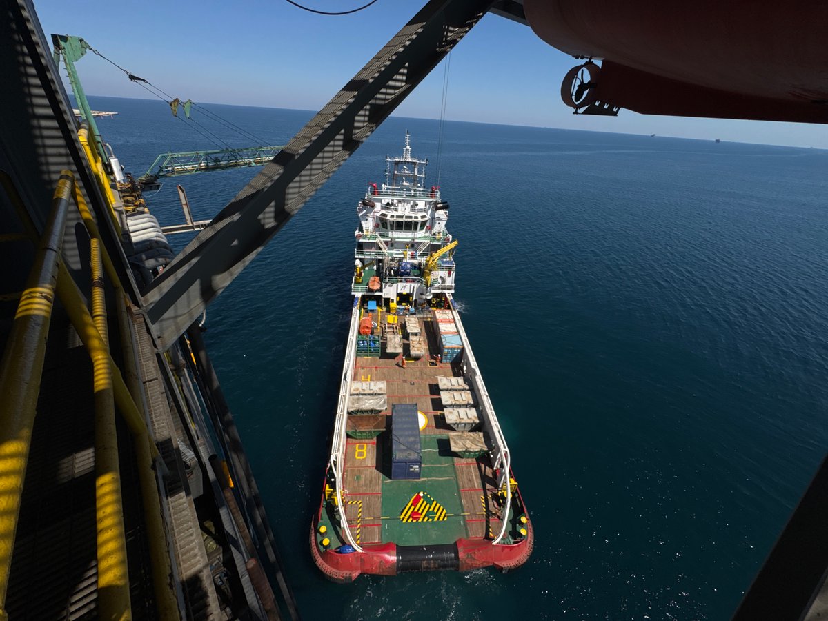 Cargo vessel deck operations and loading off the Italian coast