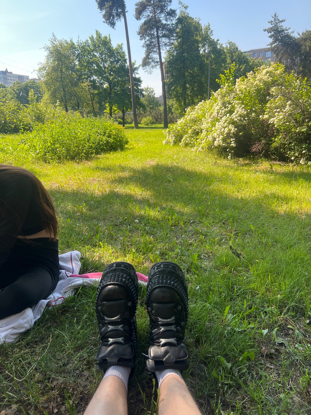 Person rests in sunny Saint Petersburg park