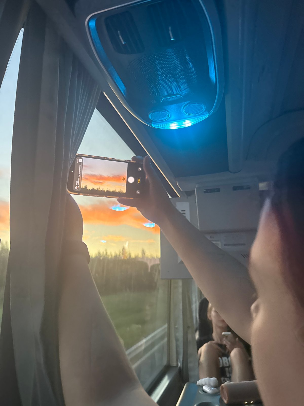 Passenger captures sunset photo from vehicle in Федькино, Russia