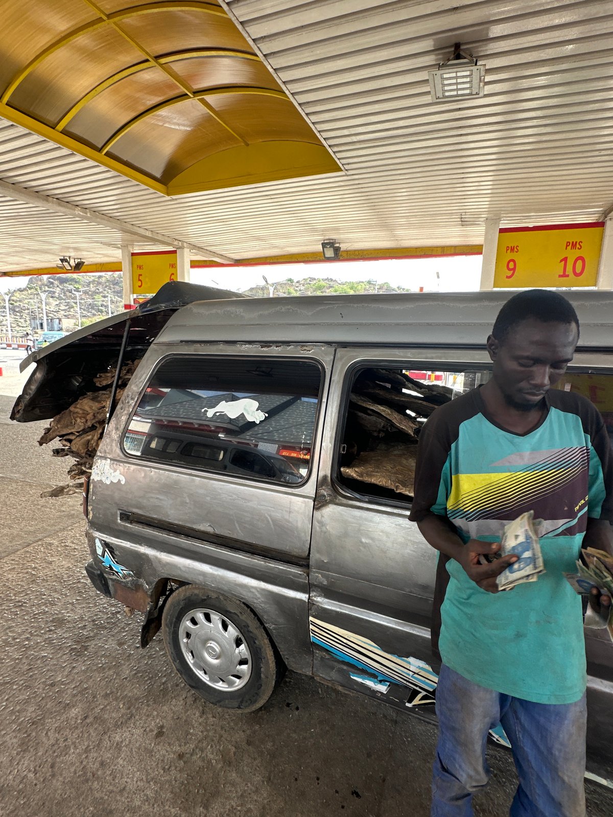 Vehicle repairs and infrastructure work documented in Jos, Nigeria