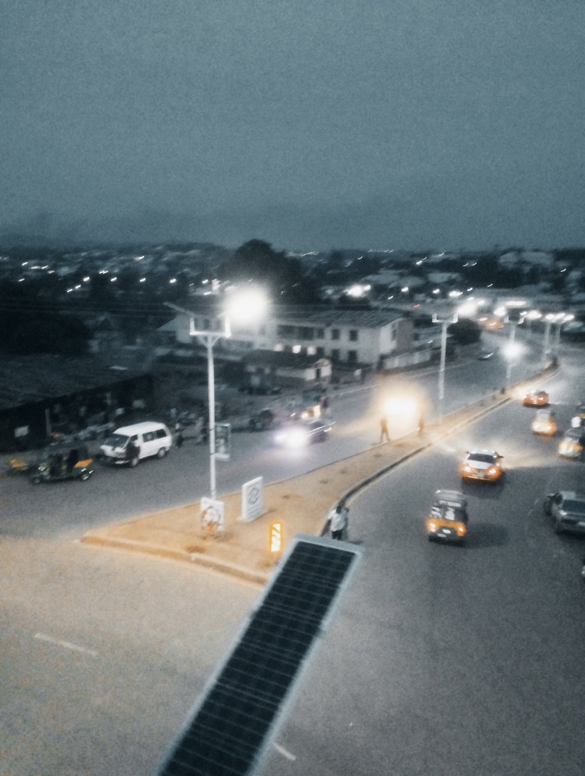 Jos streets and skies after dark, lanterns and headlights