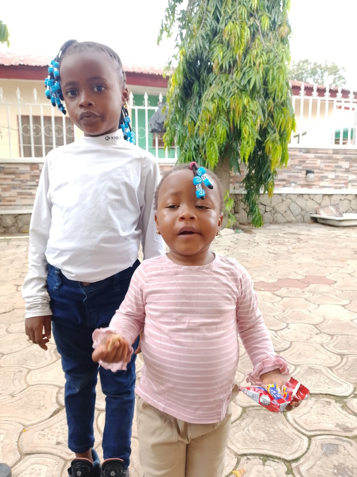 Community Life: Children, Cars, and Commerce Captured in Afternoon