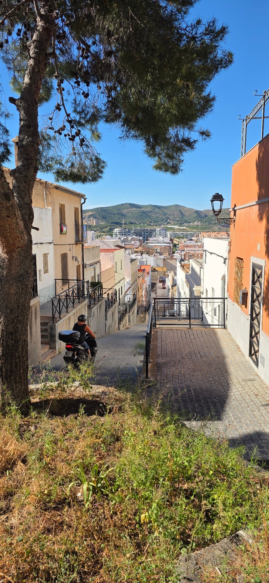 Tourist documents walking tour of historic Sagunto Castle Spain
