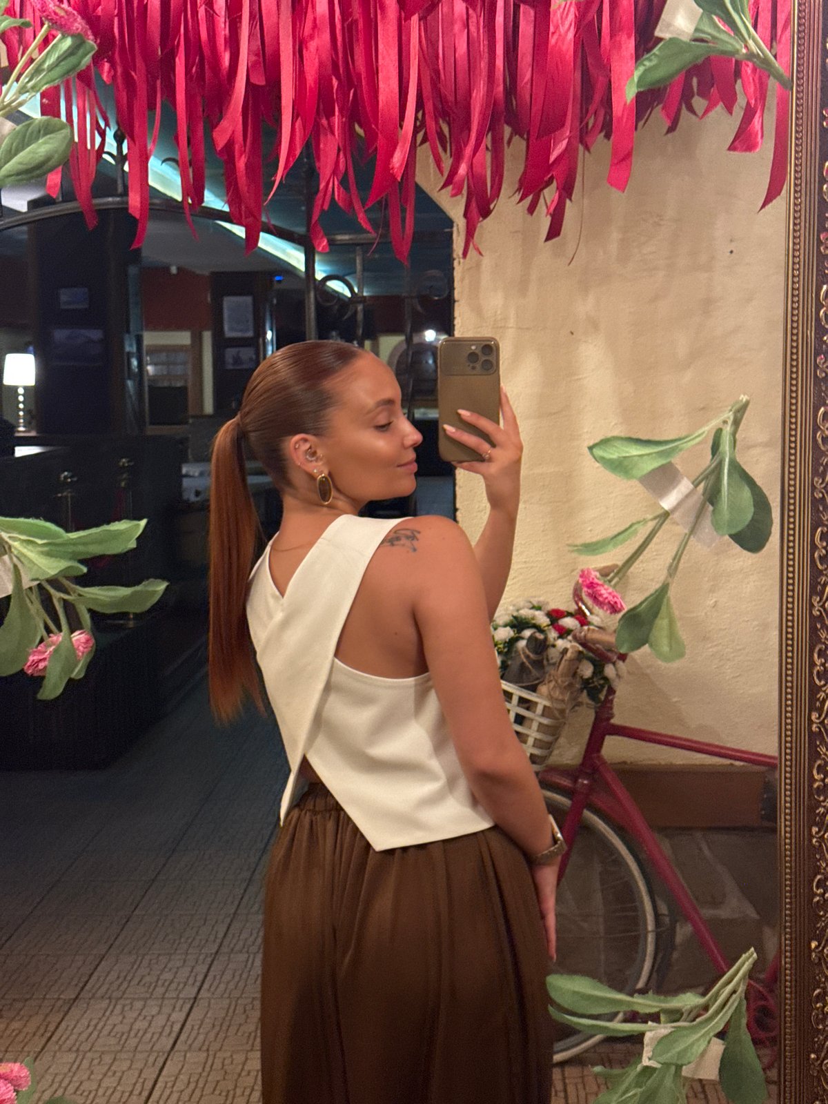 Woman takes mirror selfies at Chaikovsky establishment
