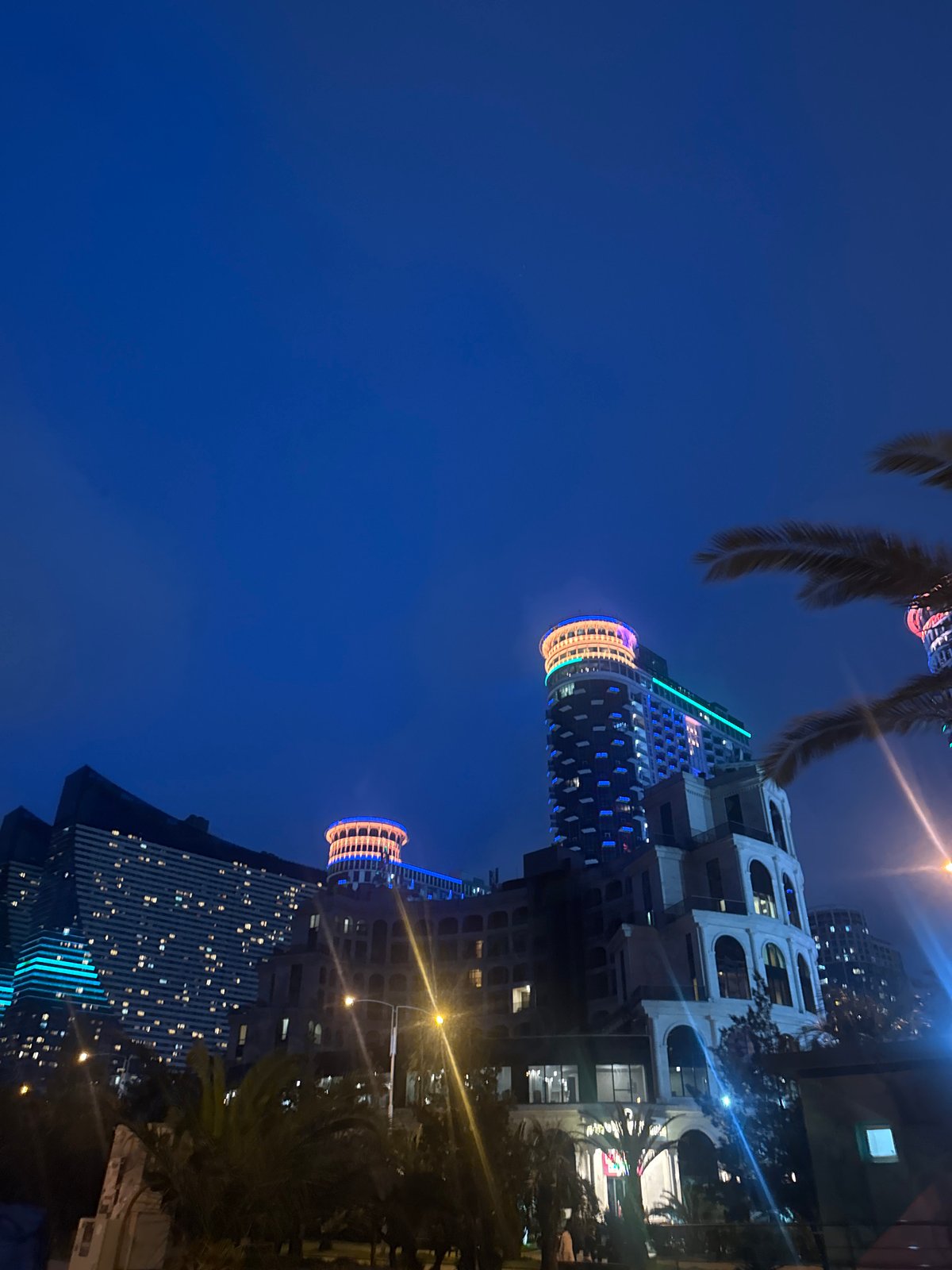 Nighttime coastal city scenes documented during eight-minute evening period