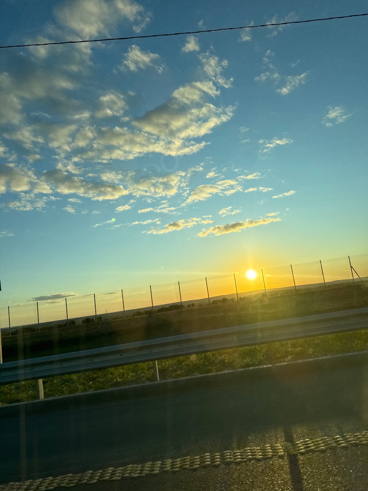 Highway sunset captured near Kazy-El'dyak, Russia