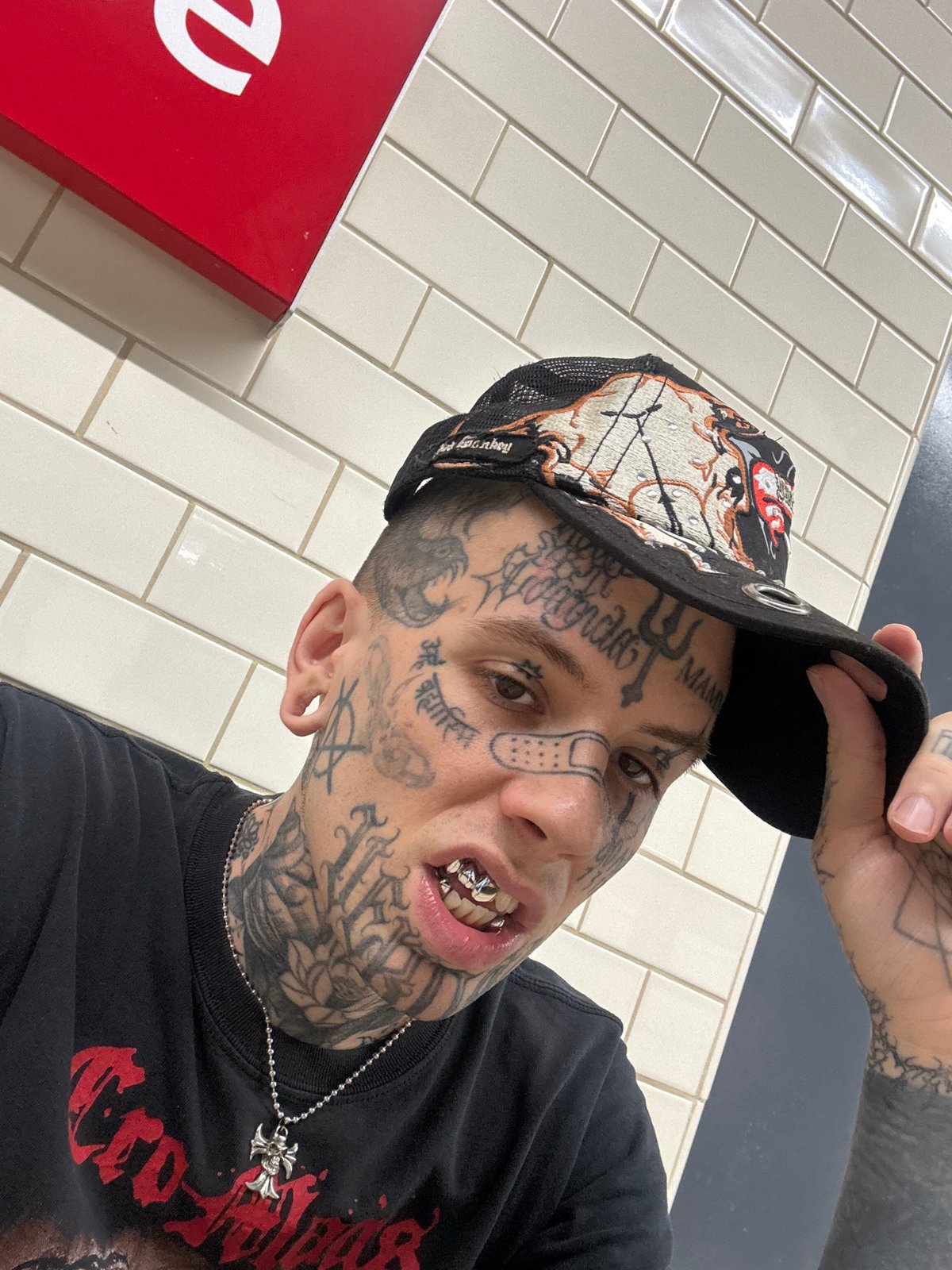 Tattooed man takes selfie in Buenos Aires