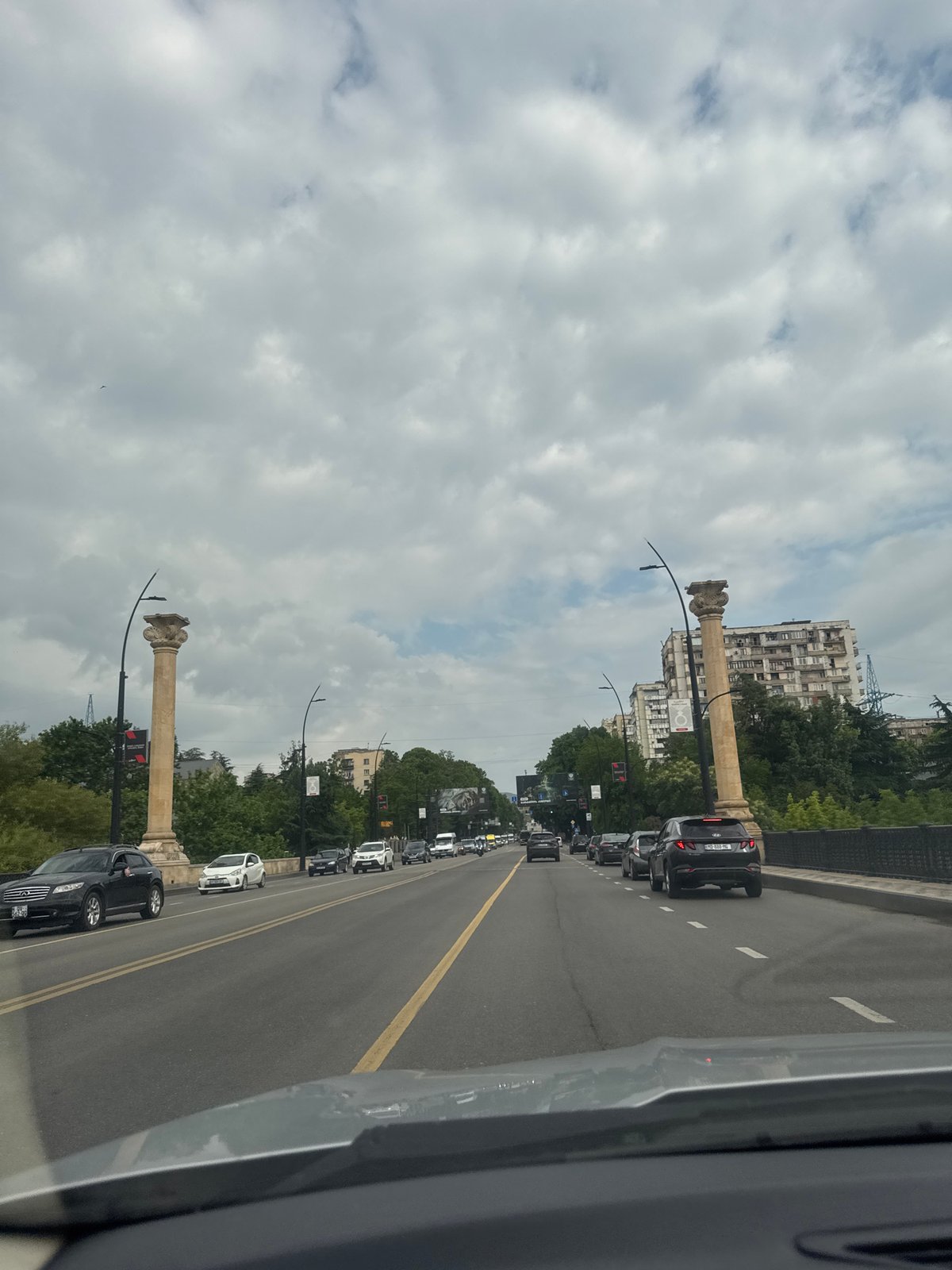 Woman takes selfies while driving in Tbilisi traffic