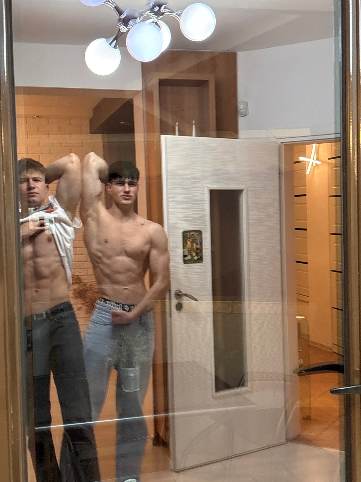 Young men take mirror selfies in Plovdiv home