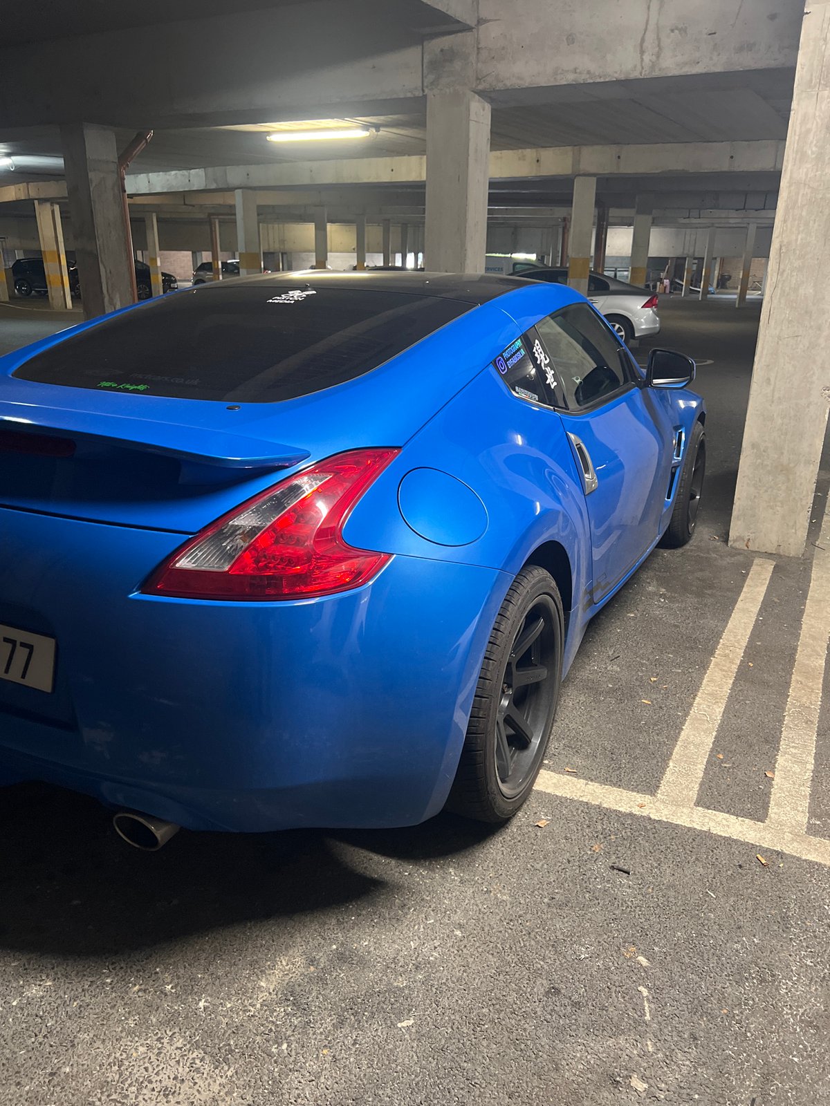 Vehicles spotted in underground parking garage during midday