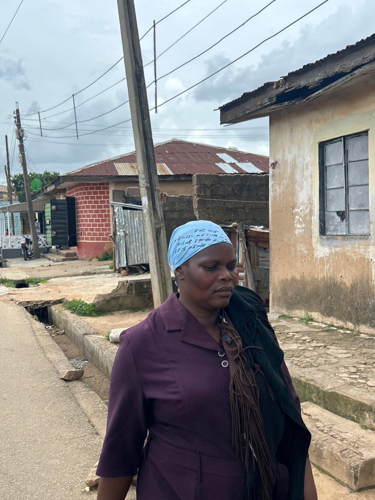 Ordinary street life across a Jos, Nigeria neighborhood.