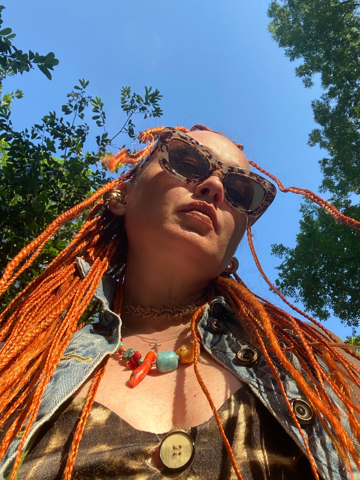 Tourist with orange braids visits Sochi landmarks, fountains
