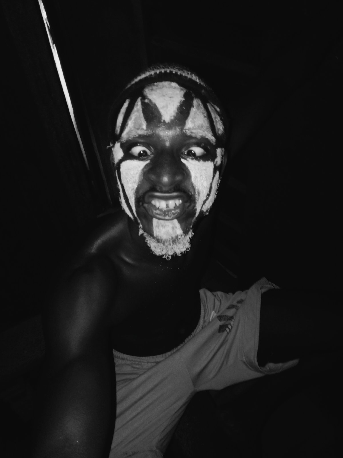 Traditional white face paint portraits captured in Onitsha