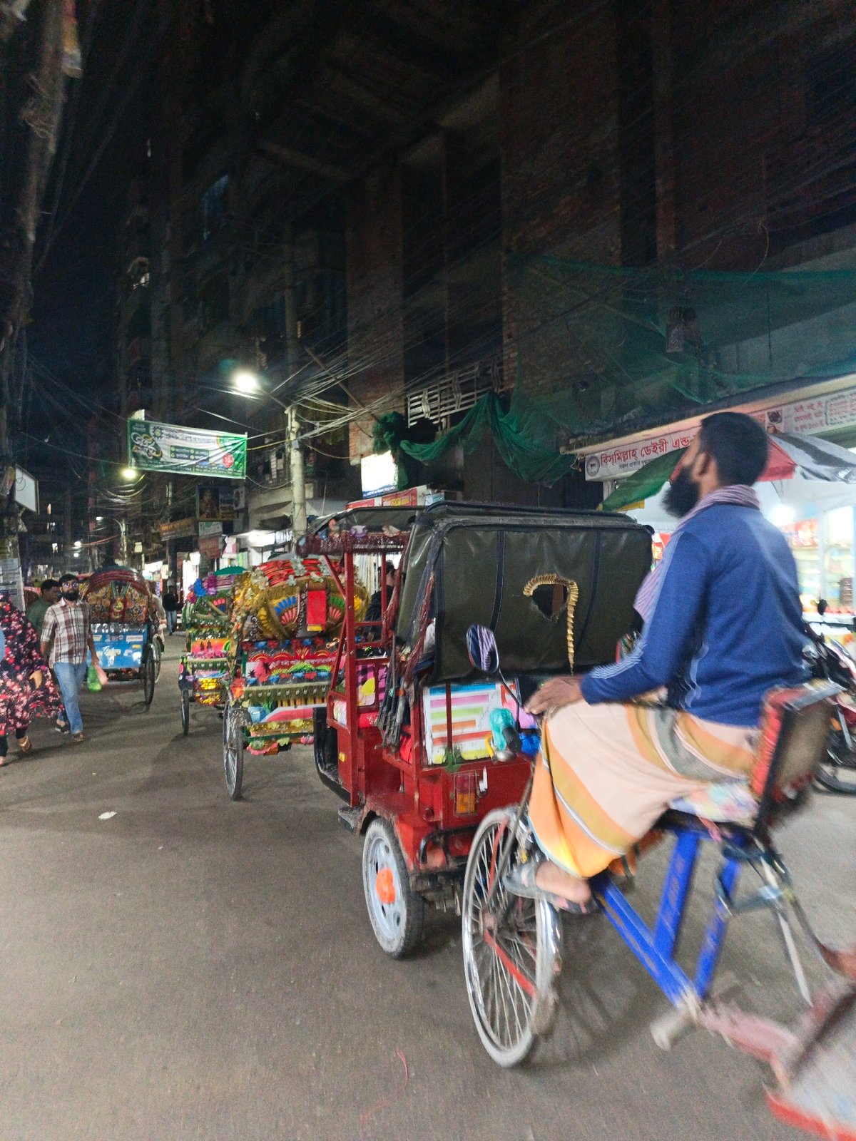 Urban South Asian street life documented in evening scenes
