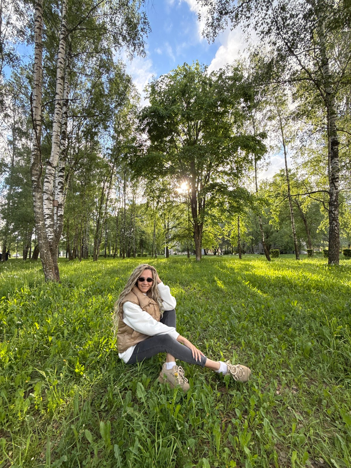 Woman enjoys afternoon relaxation in Rusanovo park, Russia