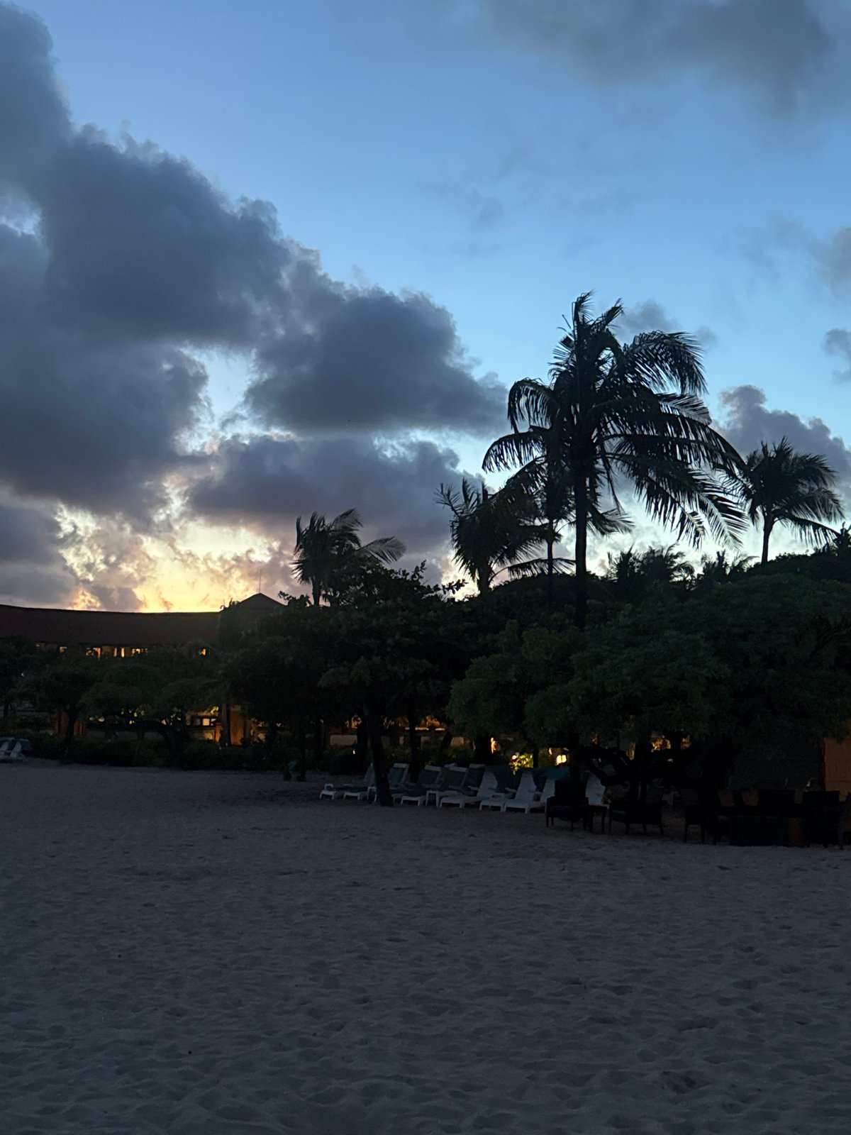 Evening beach scene documented in Indonesia with dramatic skies