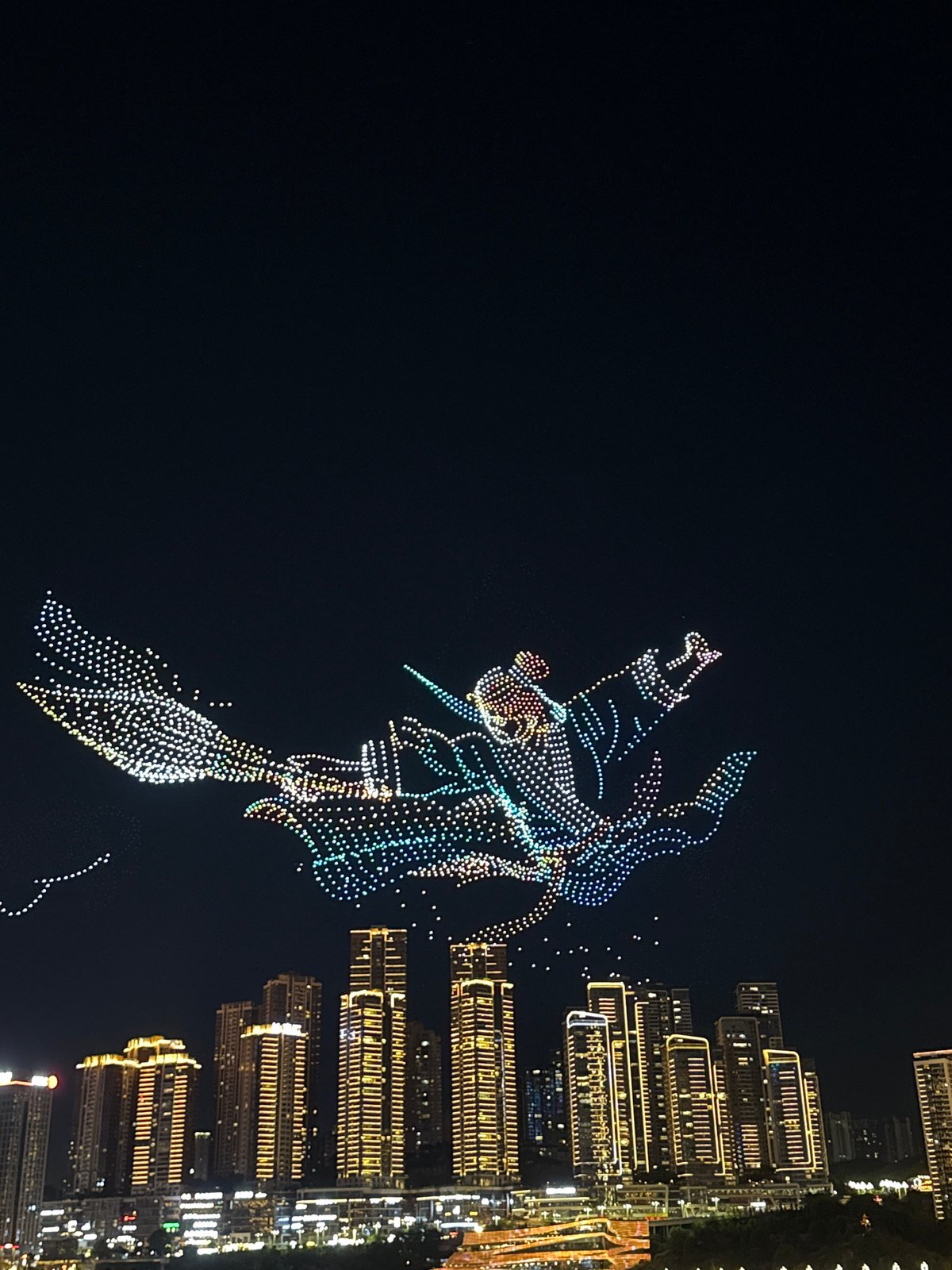 Drone light show over Chongqing's riverfront skyline
