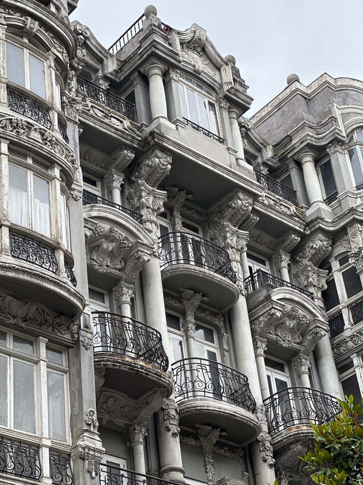 Tourist documents historic Oviedo landmarks and streets in Spain