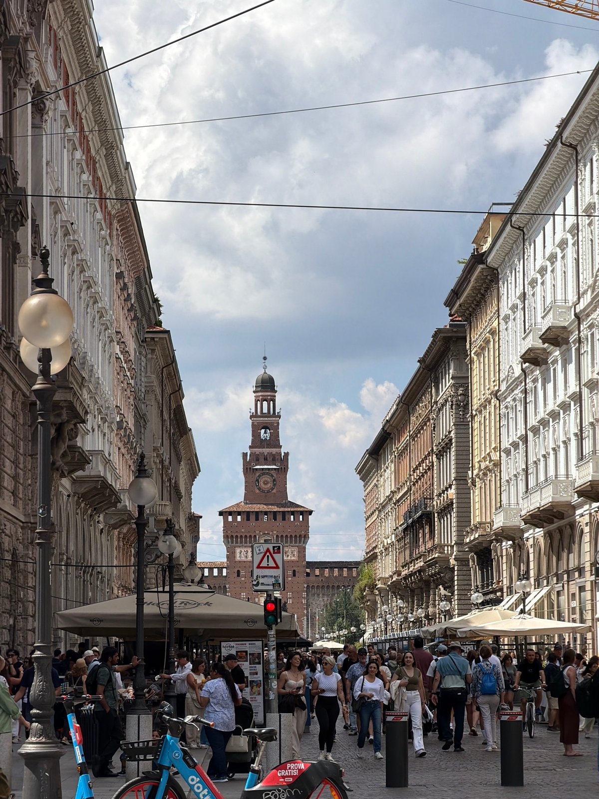 Milan street scene captures Sforza Castle tower view