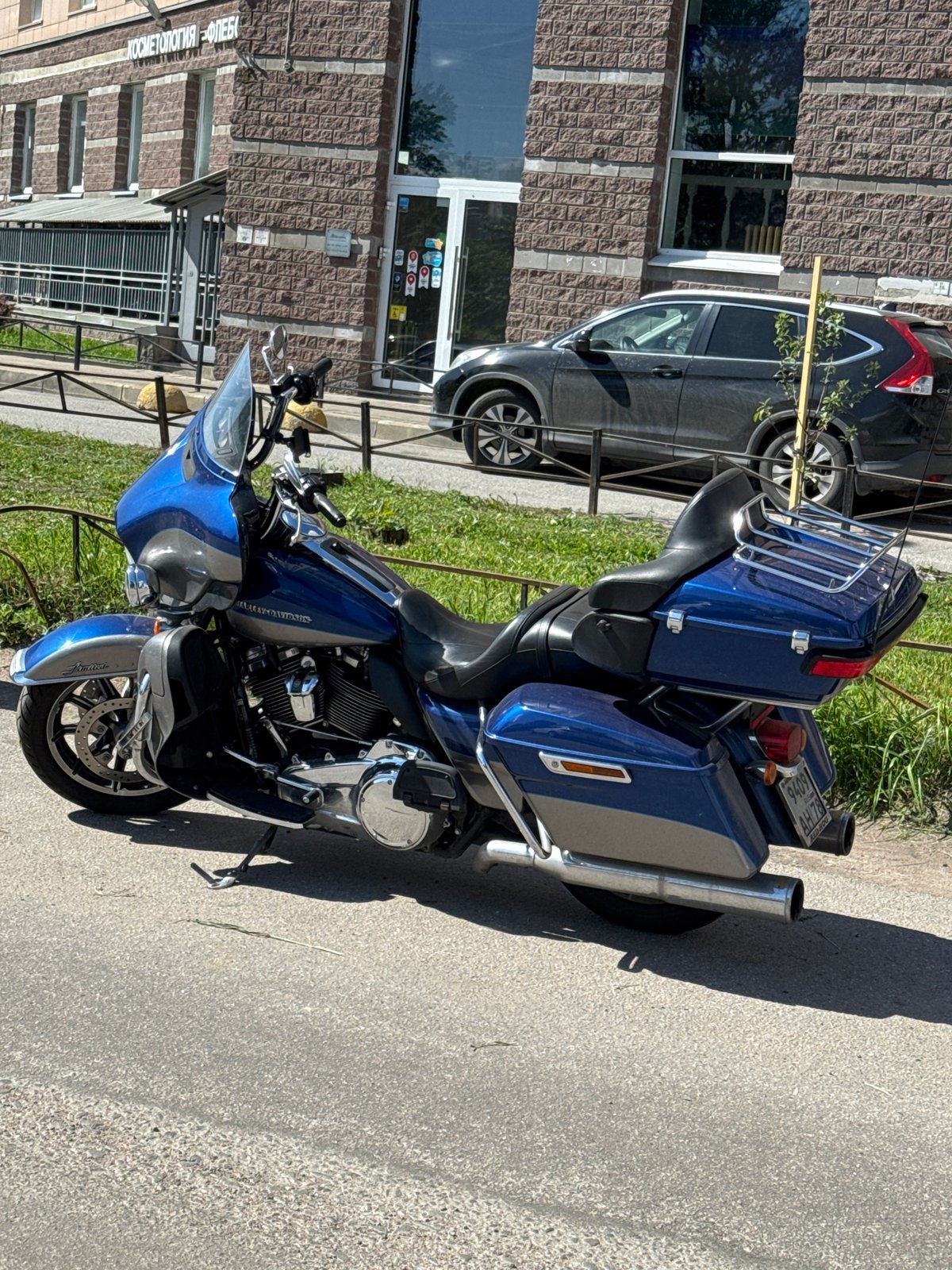 Harley-Davidson motorcycle parked on sunny street in Sinyavino, Russia