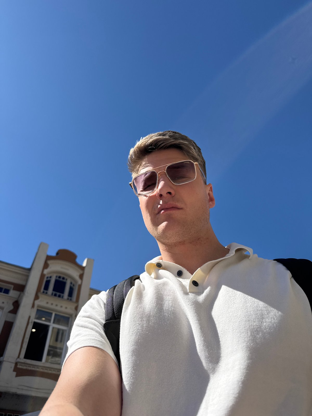Tourist explores historic Plovdiv, samples local flatbread near church
