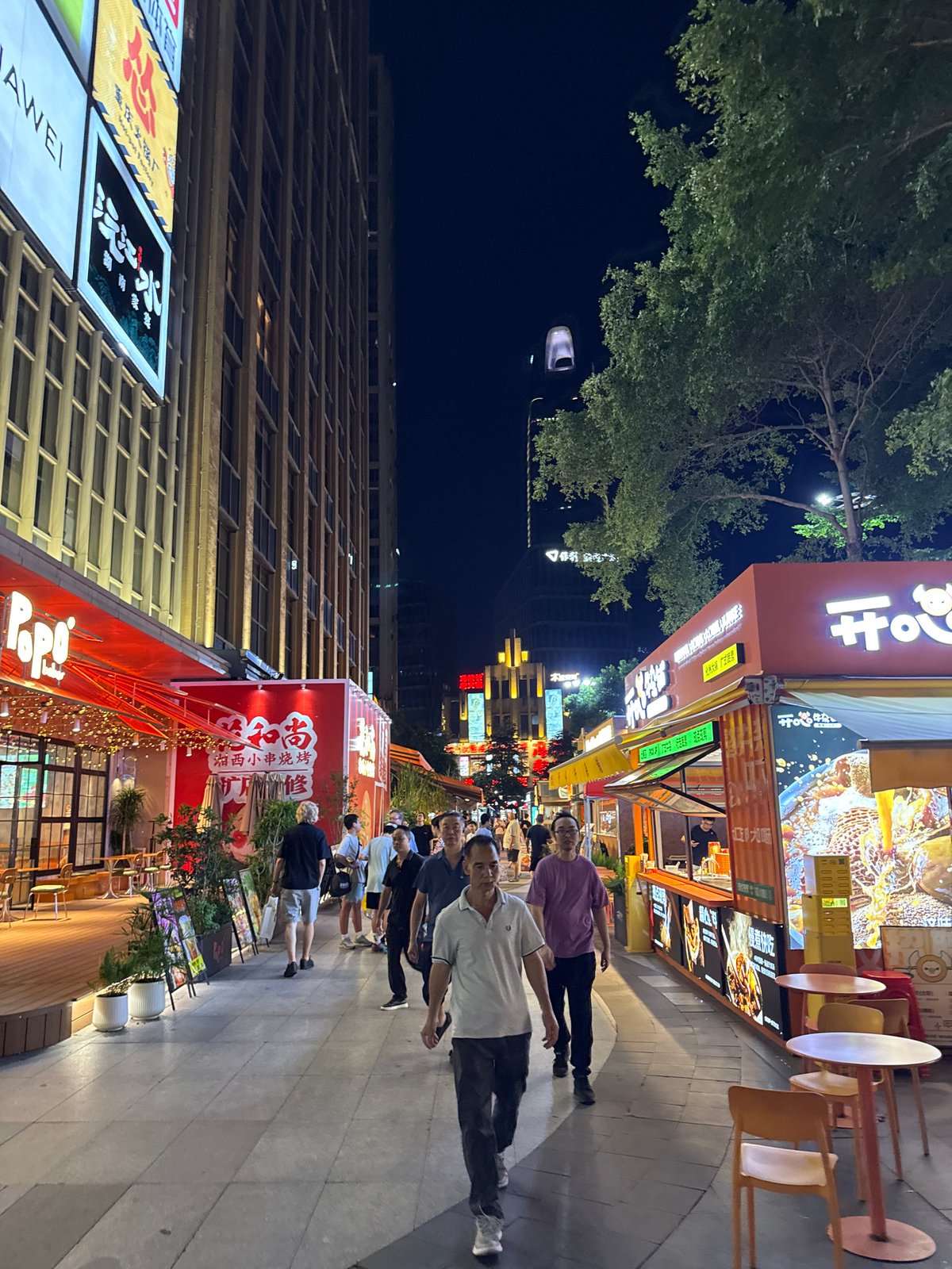 Haizhu District commercial strip buzzing on a summer evening
