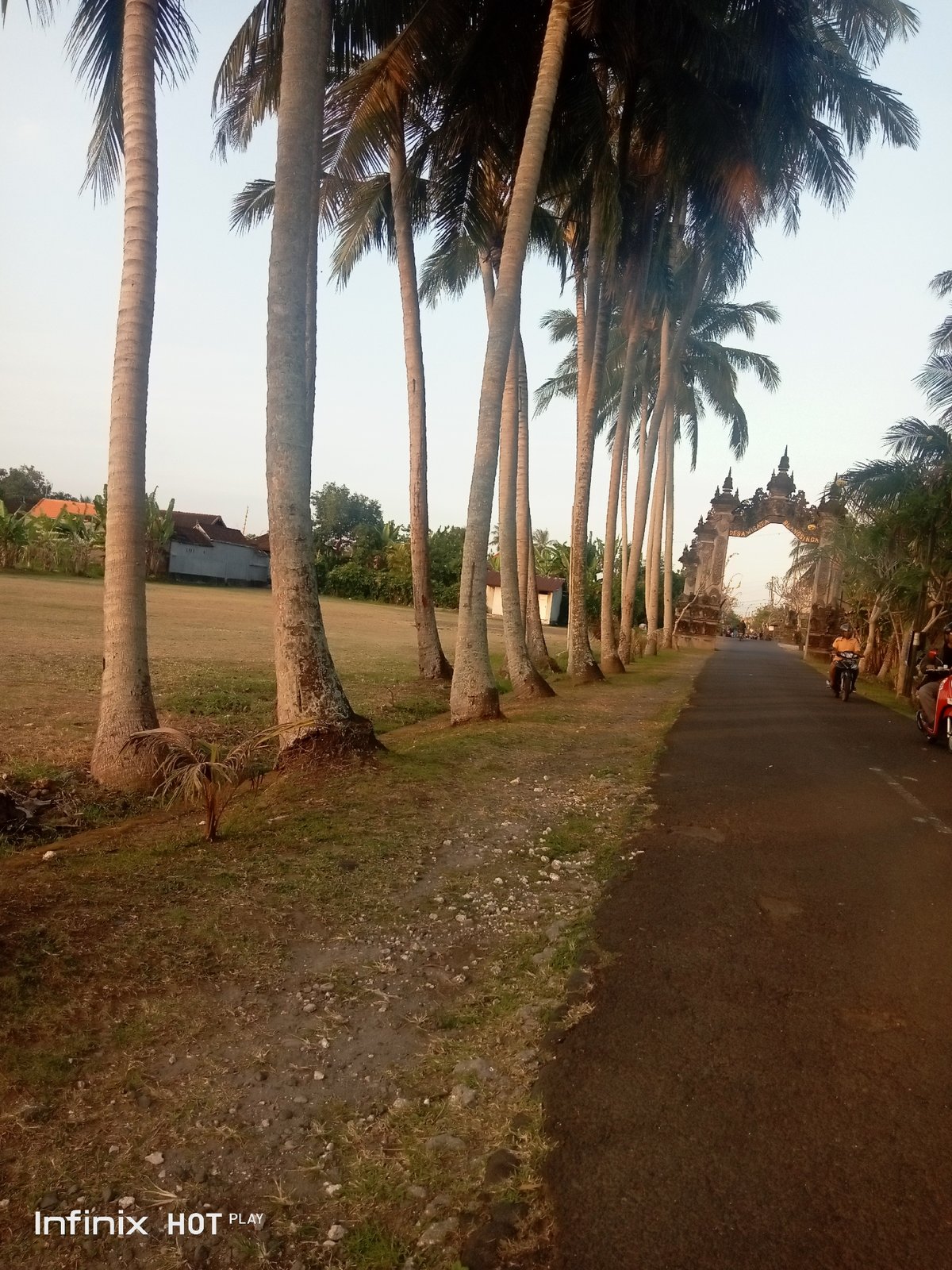 Temple grounds in Blahbatuh: gates, statues, and a resting dog